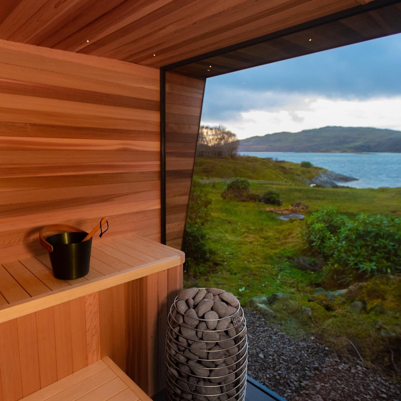 Custom Modern Sauna With Glass Wall and HUUM Hive Mini and Water View