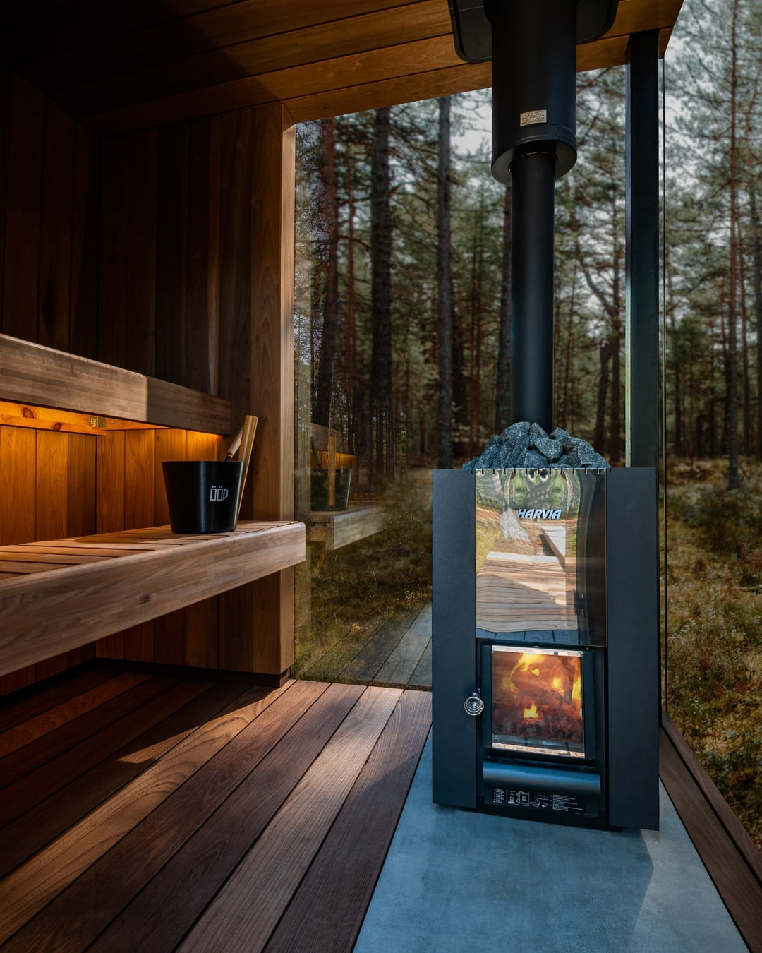 Custom Outdoor Sauna With Large Glass Windows and Harvia Wood Stove