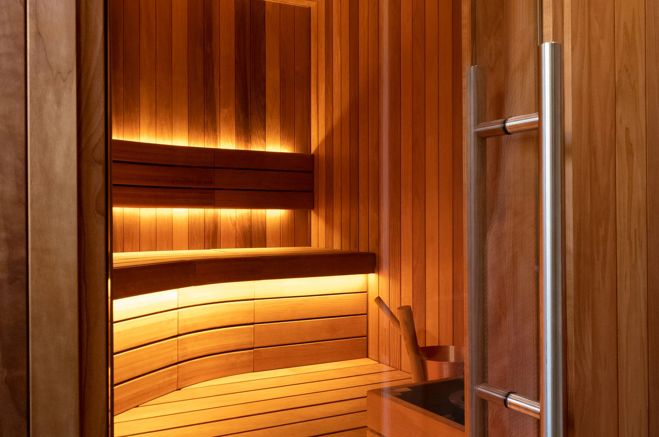 Custom Sauna With Curved Benches and Vertical Cladding