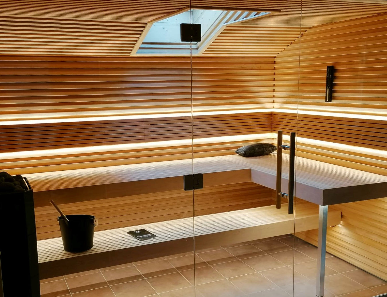 Custom Sauna With Floating Benches and Skylight