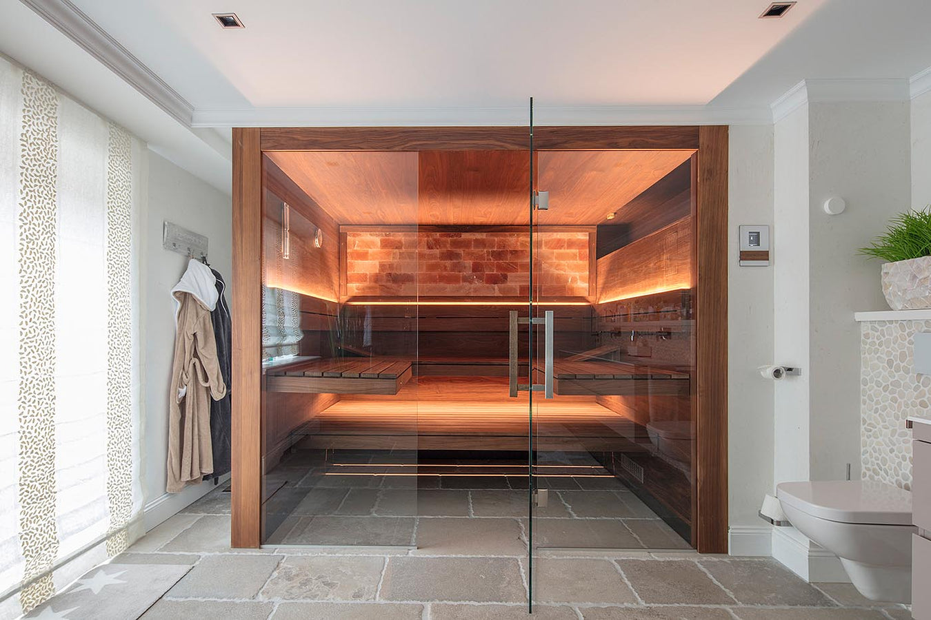 Custom Sauna With Glass Front, Salt Wall and High Benches