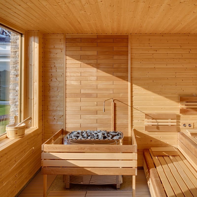 Custom Sauna With Light Wood and Large Electric Heater