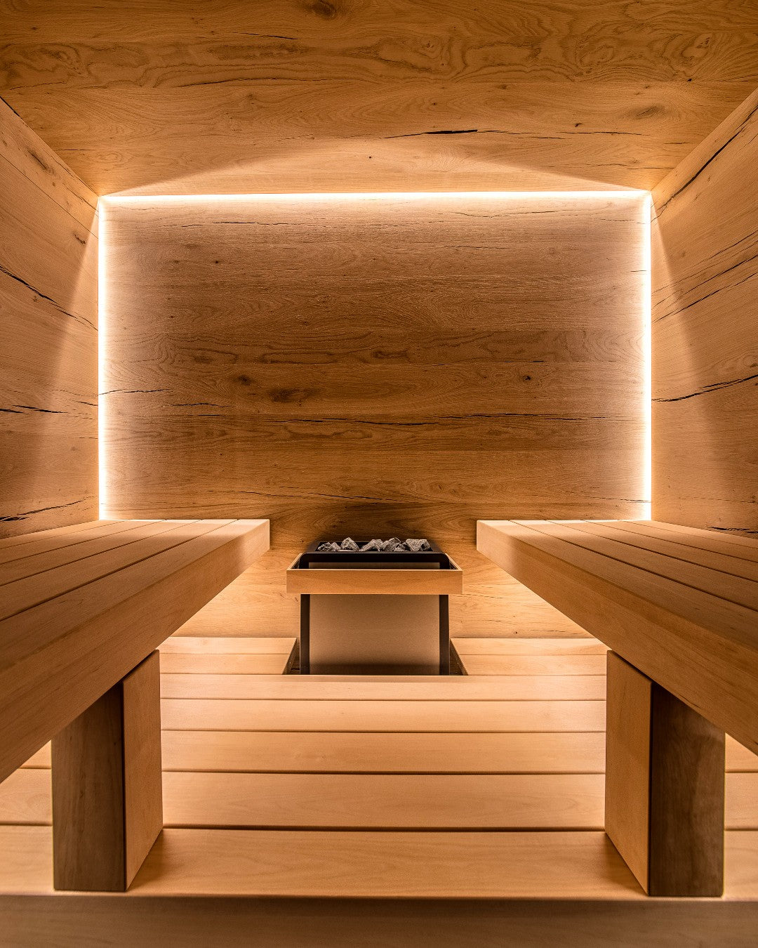 Custom Sauna With Lighting around Back Trim and Center Harvia Heater