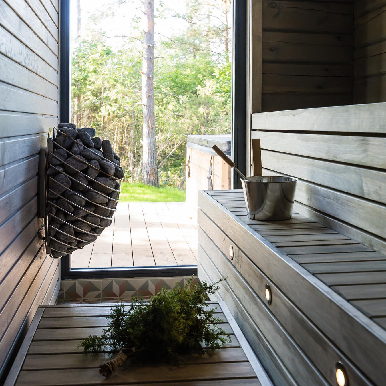 Dark Outdoor Custom Sauna With HUUM Drop Heater