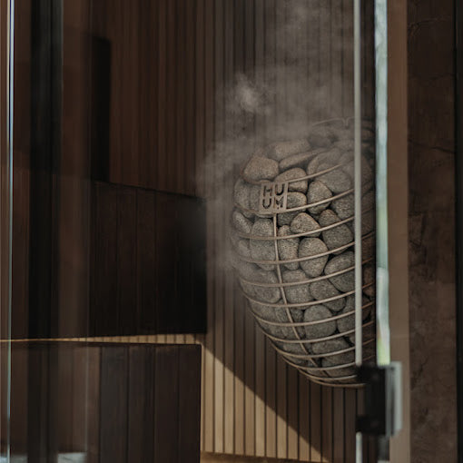 HUUM Drop in Custom Sauna With Steam Coming Off It