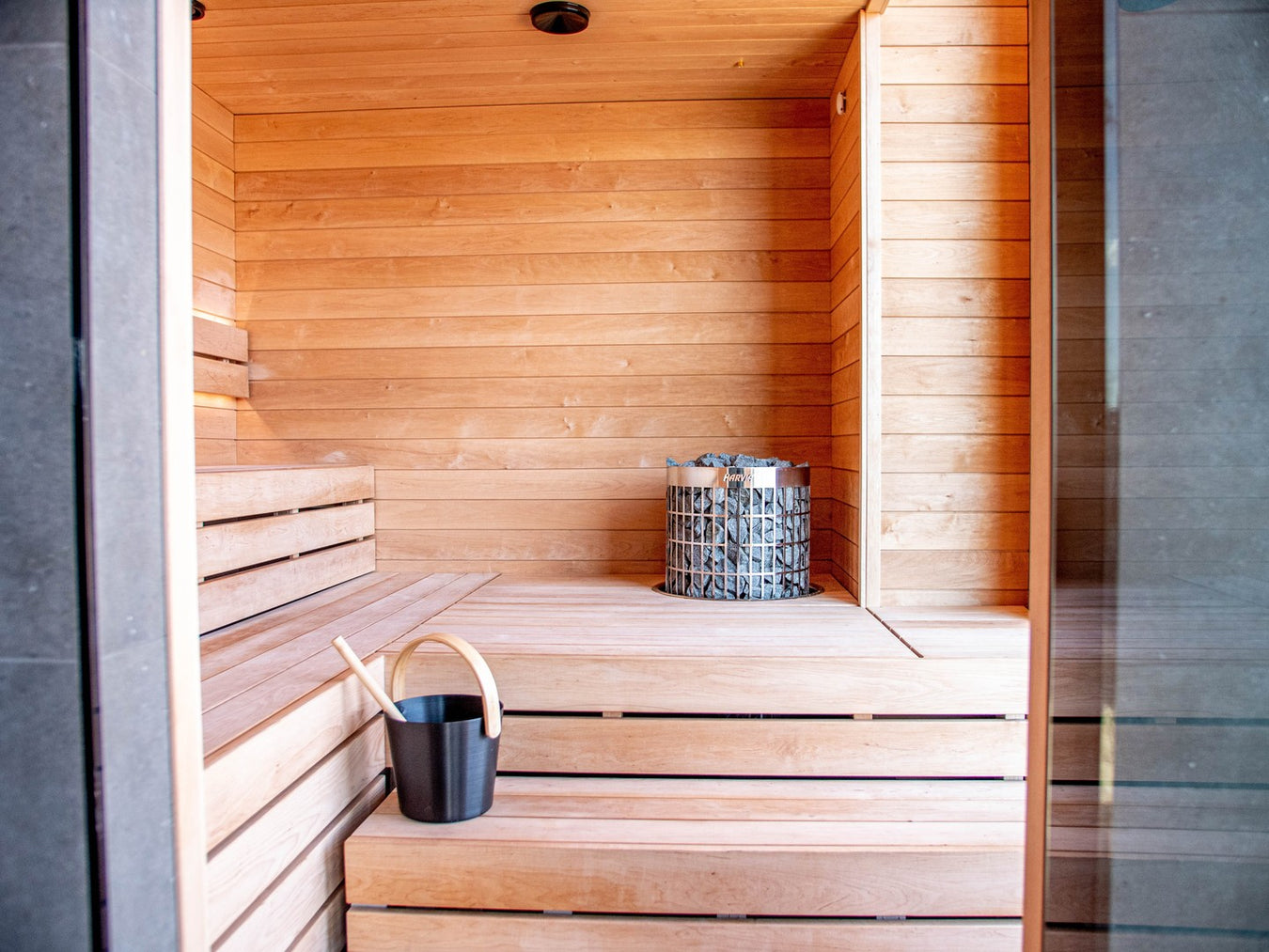 Light Premium Sauna With Raised Floor and Recessed Harvia Cilindro Heater