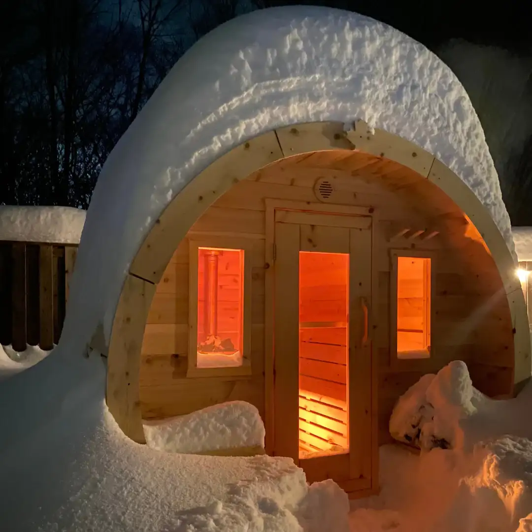 Outdoor Barrel Sauna With Snow on Roof